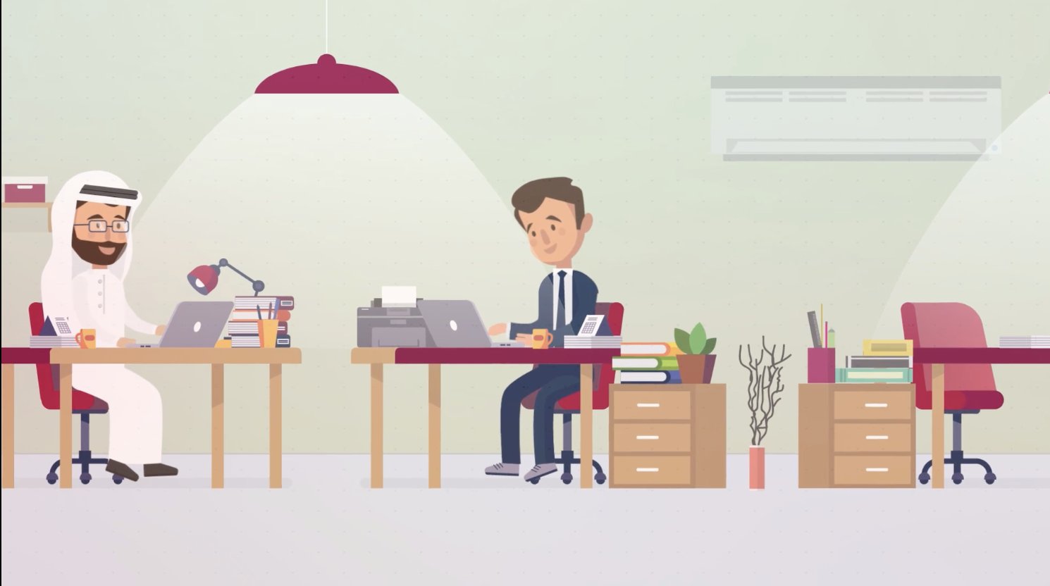 Workplace scene — two professionals at desks in a modern office