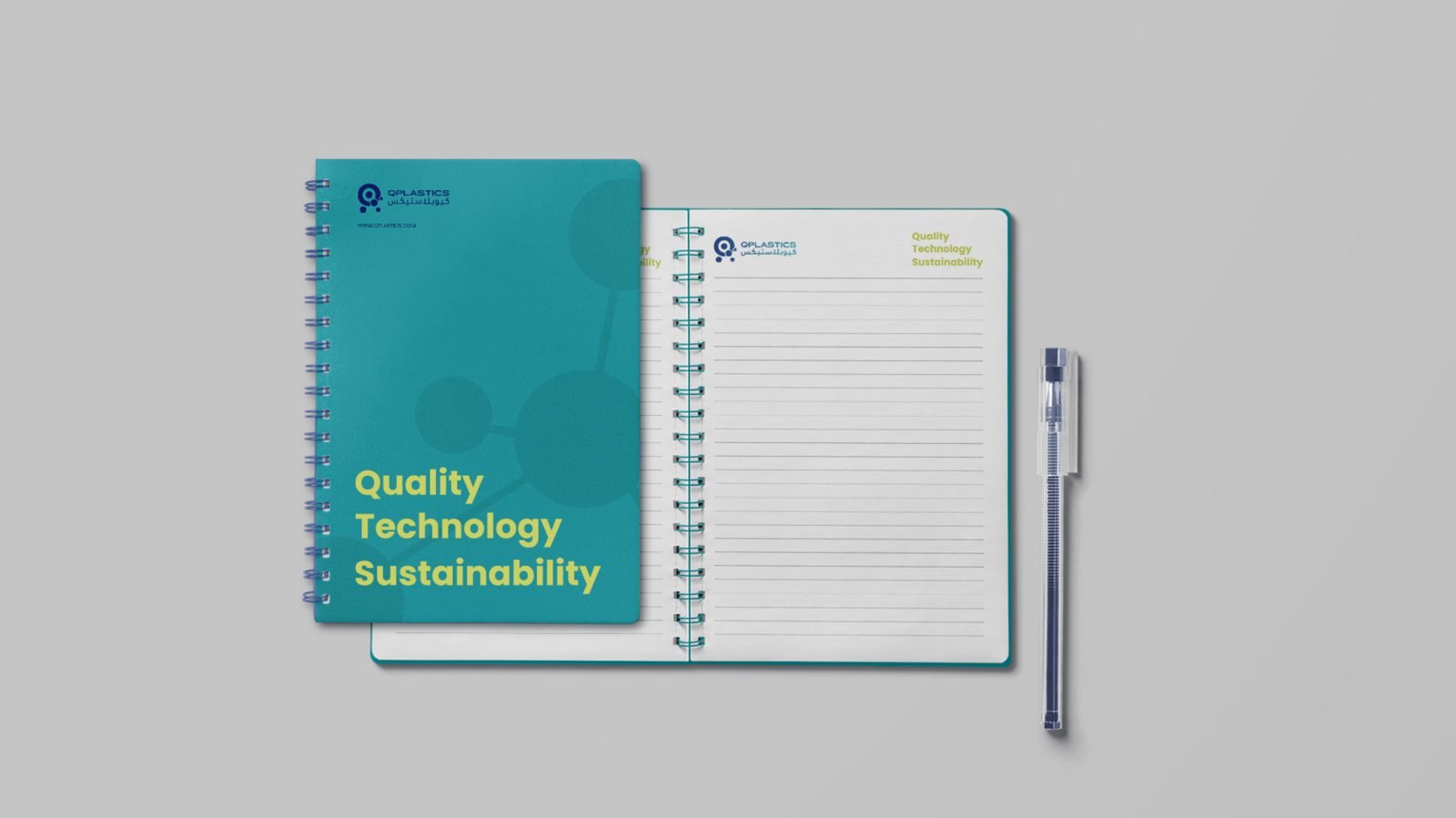 Branded notebook with teal cover — Quality / Technology / Sustainability tagline